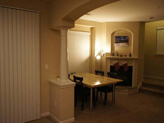 Gas Fireplace and Stairs to Bedroom