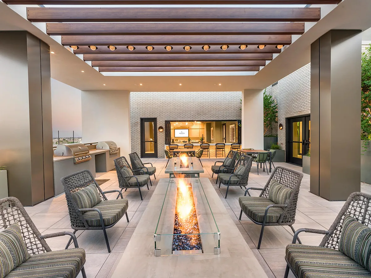 Take in the mountain views and relax by the firepits_this rooftop offers a peaceful place to unwind. - Modera Scottsdale