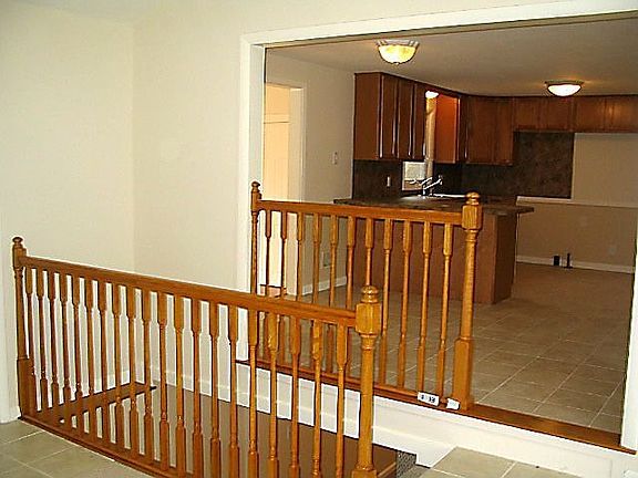 Family Room overlooks Finshed Basement Playroom below