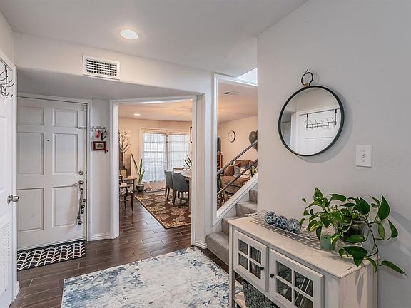 View of front entrance and open foyer, over looking front dining or living room