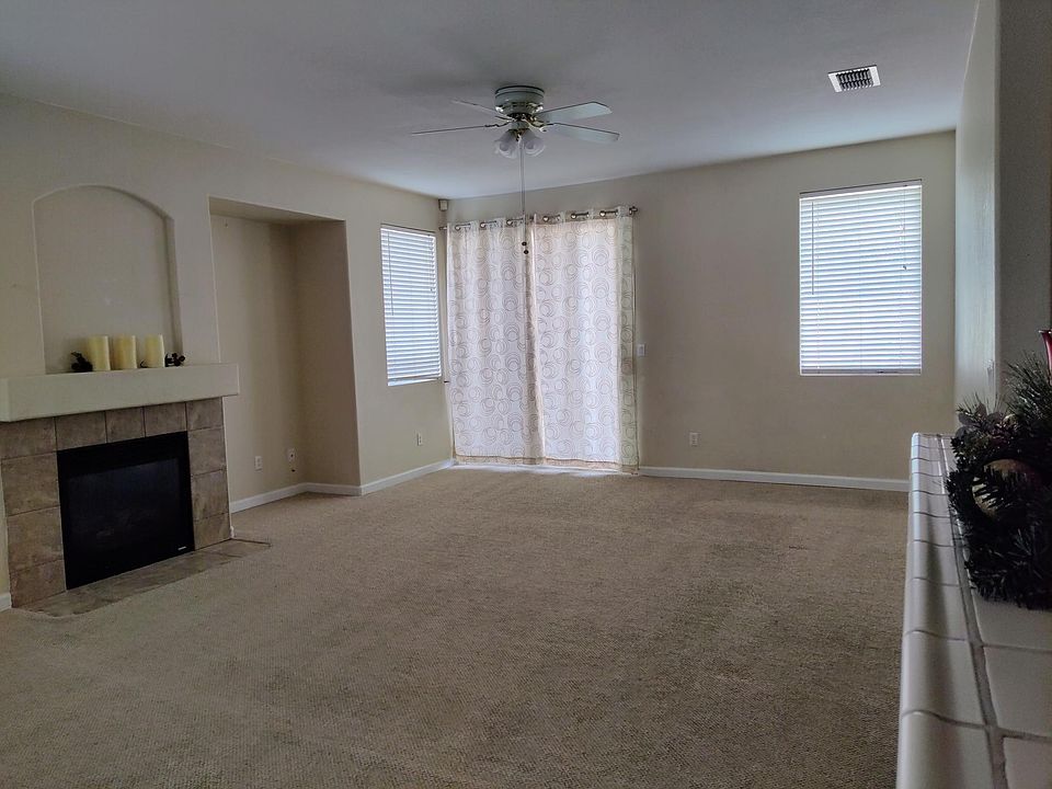 Great room/family room. 
NOTE: Carpet will be replaced with vinyl planks all throughout the house prior to move-in.