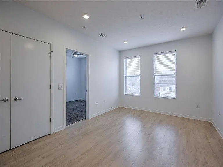 Living room with storage in a unit at The Rise.