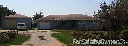 Front of home
						:
						Home and garage/workshop is fully vinyl sided