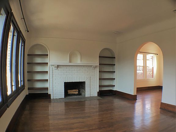 Living room with wood-burning fireplace