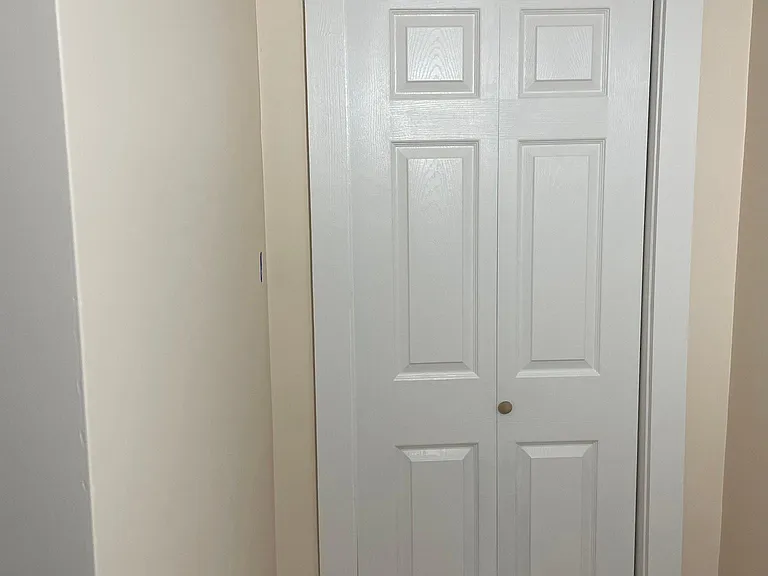 The bedroom also has a large closet with its own light.