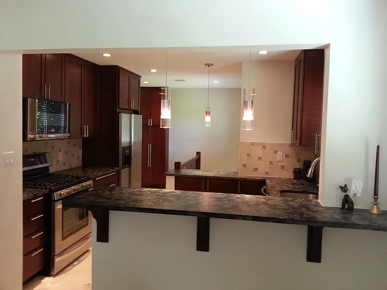 Granite counters and tile backsplash.