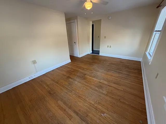 Living towards the hall. Door on left is a storage closet nook off living