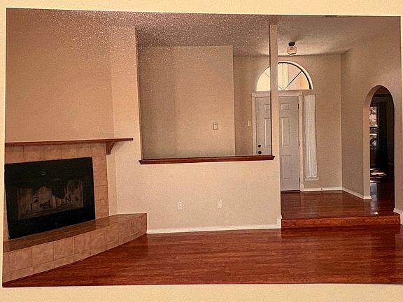 Entryway, living room, fireplace