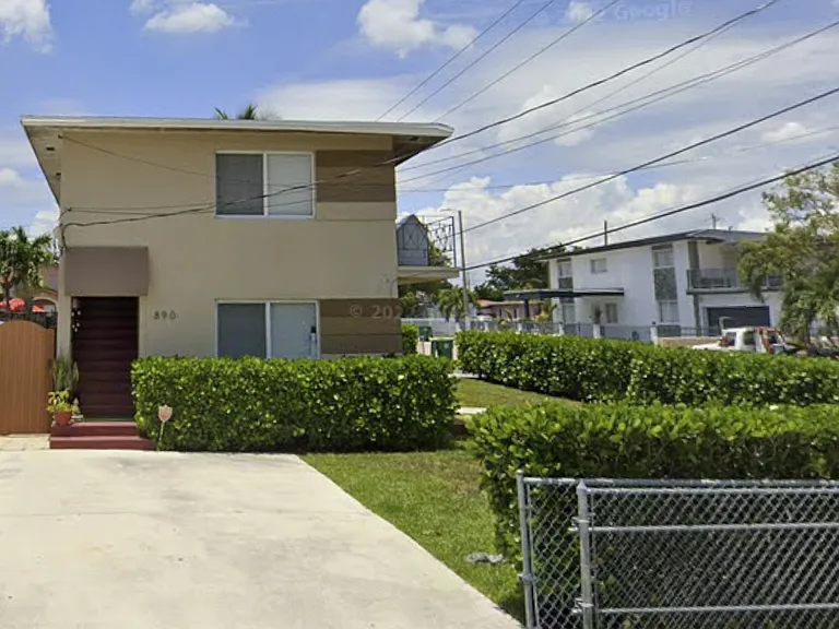 Front entrance & Parking for 2 cars with a fence.