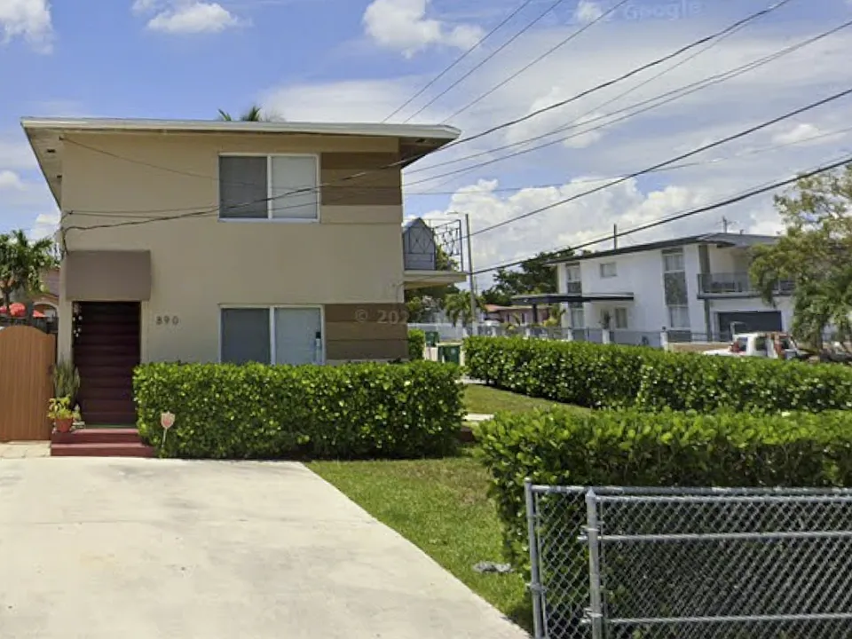 Front entrance & Parking for 2 cars with a fence.