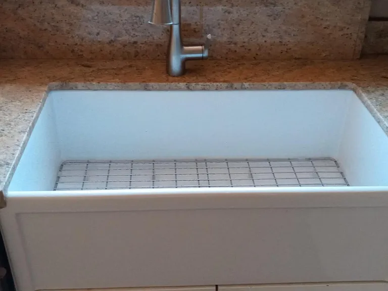 kitchen with country sink and new appliances.