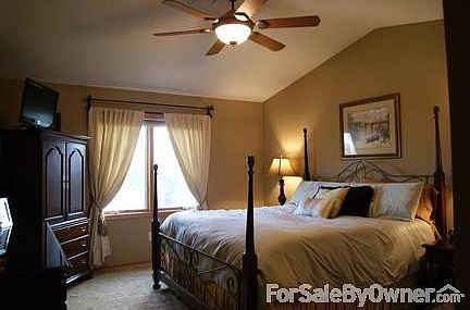 Vaulted master BR with king size bed