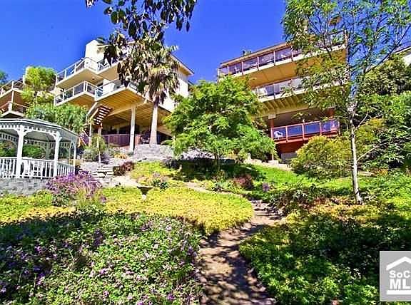 over 8,000 SF lot with Avocado Trees