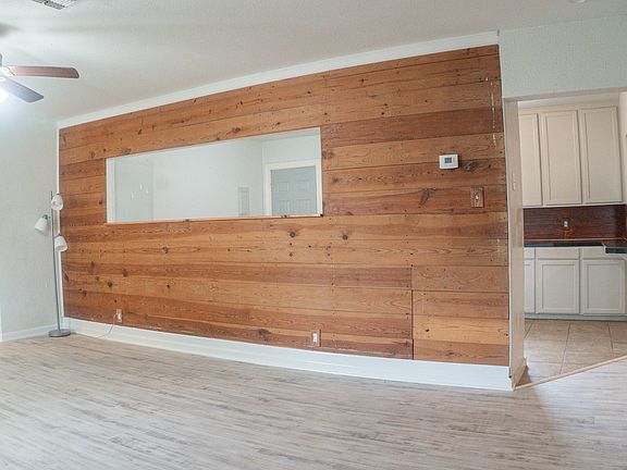 Living Room upon front door entry. Original shiplap!
