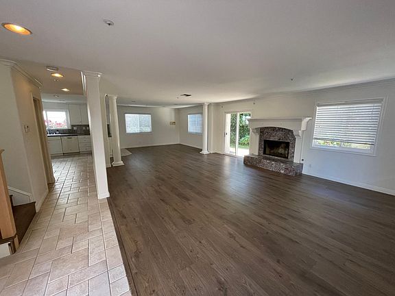Open spaces of living room and dining areas. Fireplace in the center brings warmth to the house especially in holiday season.