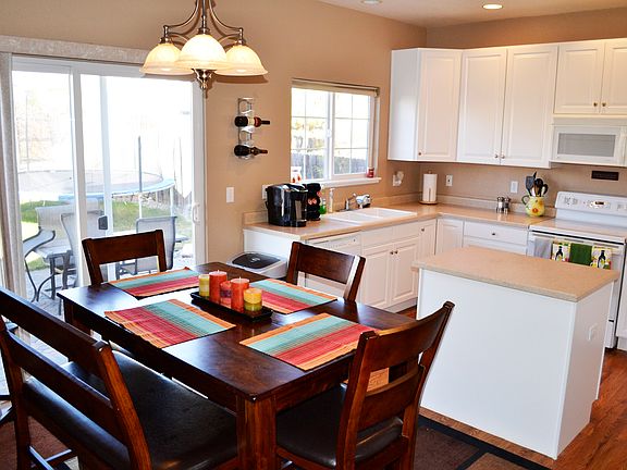 Spacious kitchen with dining area and island.