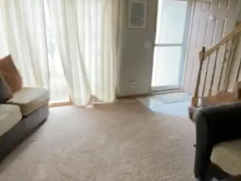 Living room with large ceiling