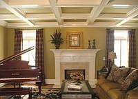 Formal living room with fireplace and coffered ceiling 
