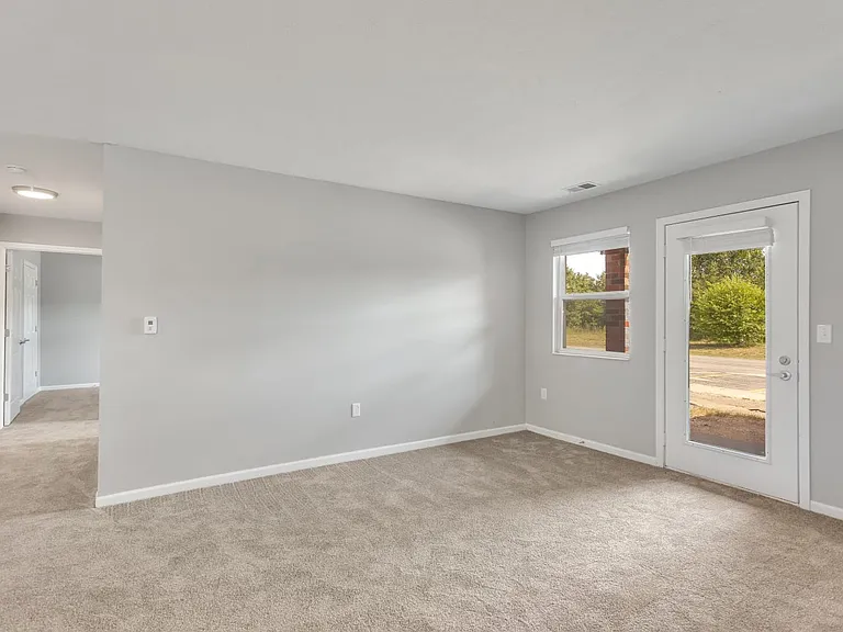 Clean, neutral living spaces with plush carpeting and fresh white walls provide the perfect canvas for your personal style, professionally managed by Highlands Vista Group.