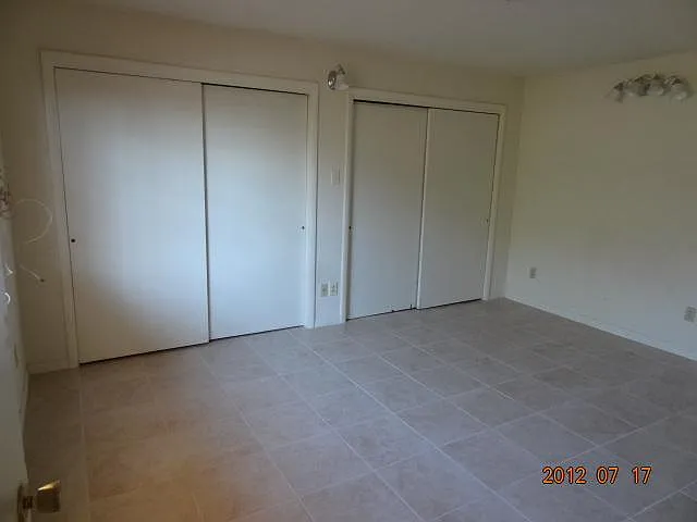 Master bedroom with double closets. Will accomodate a king sized bed easily