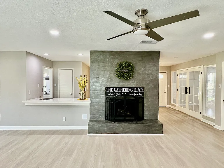 a cozy fireplace sets the perfect mood, and the elegant wet bar flows effortlessly into the space_ideal for unwinding after a long day or hosting unforgettable gatherings with family and friends.