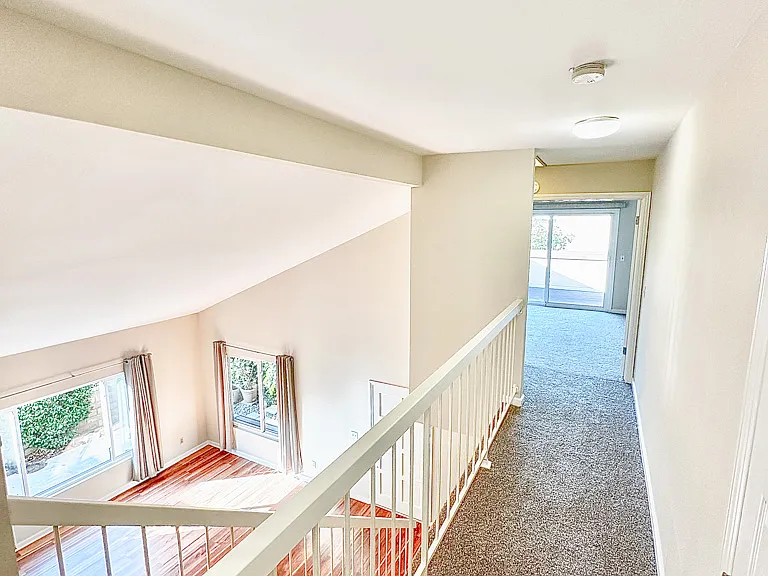Hallway to master bedroom with tons of natural light