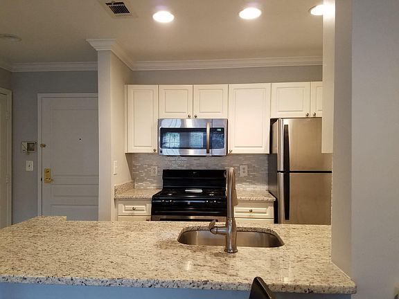 Seamless integration from kitchen into breakfast / dining area. Put some breakfast stools on the edge of countertop for easy conversation.