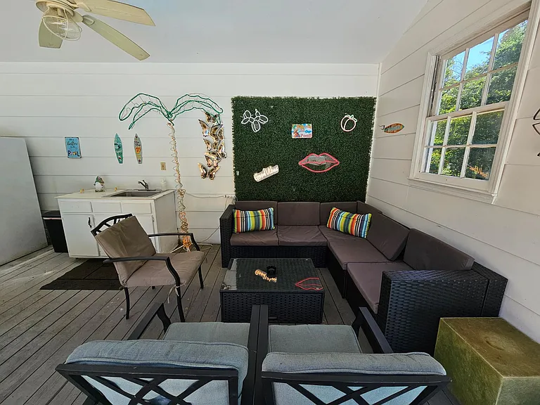 Pool house lounge with outdoor kitchen (sink only usable in summer pool season)