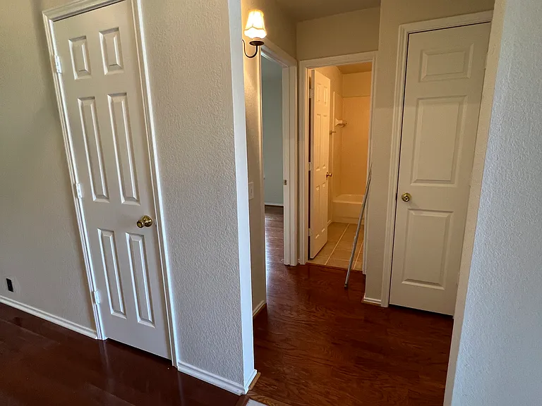 2nd and 3rd bedrooms and full bath to the right