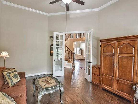 A handsome study is to the left of the foyer