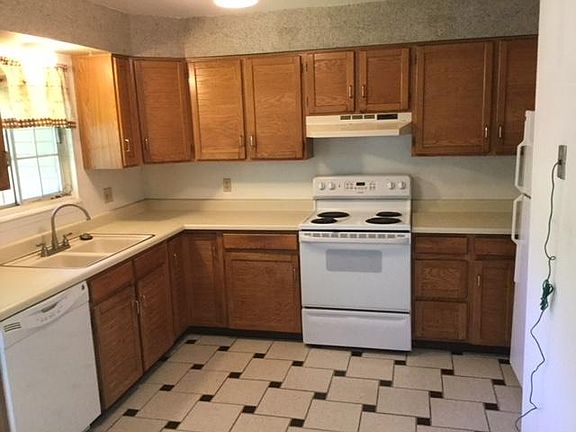 Kitchen with custom tile flooring.