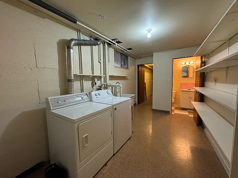 Laundry room with storage shelves