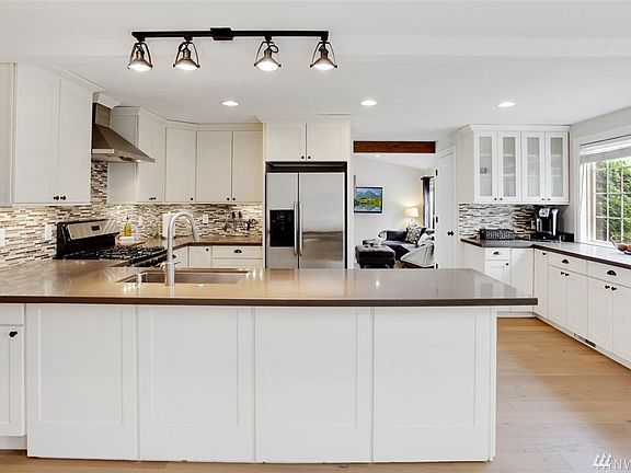 Masterfully designed kitchen w/timeless lines and modern appeal.  Solid painted wood cabinets with dovetail constructed drawers.