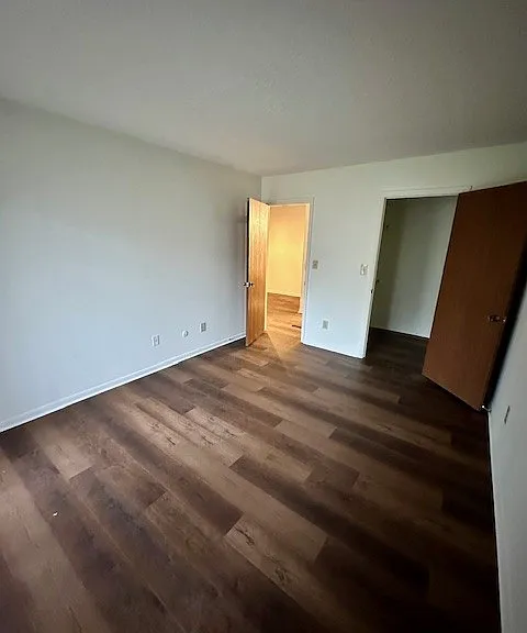 Another view of second bedroom- walk in closet is on the right