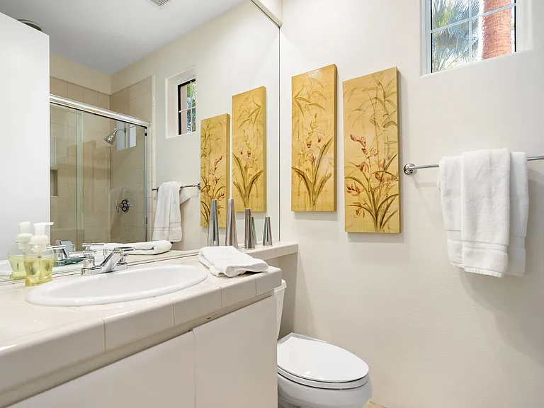 Bath/powder room with full shower by den and great room.
