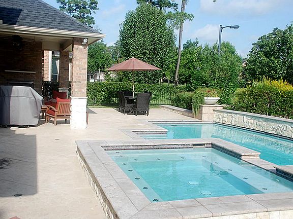 Custom built spa and pool.  Owner says cost over $100,000 including professional landscaping.