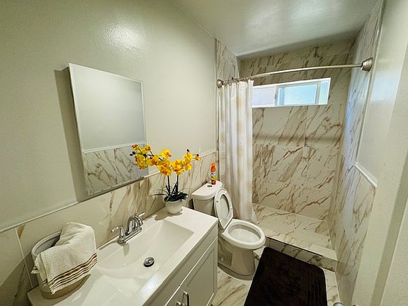 Bathroom #1 close to the living room, kitchen, and dining area