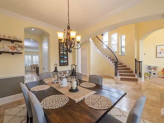 Across dining to the foyer, stair case and study/living room