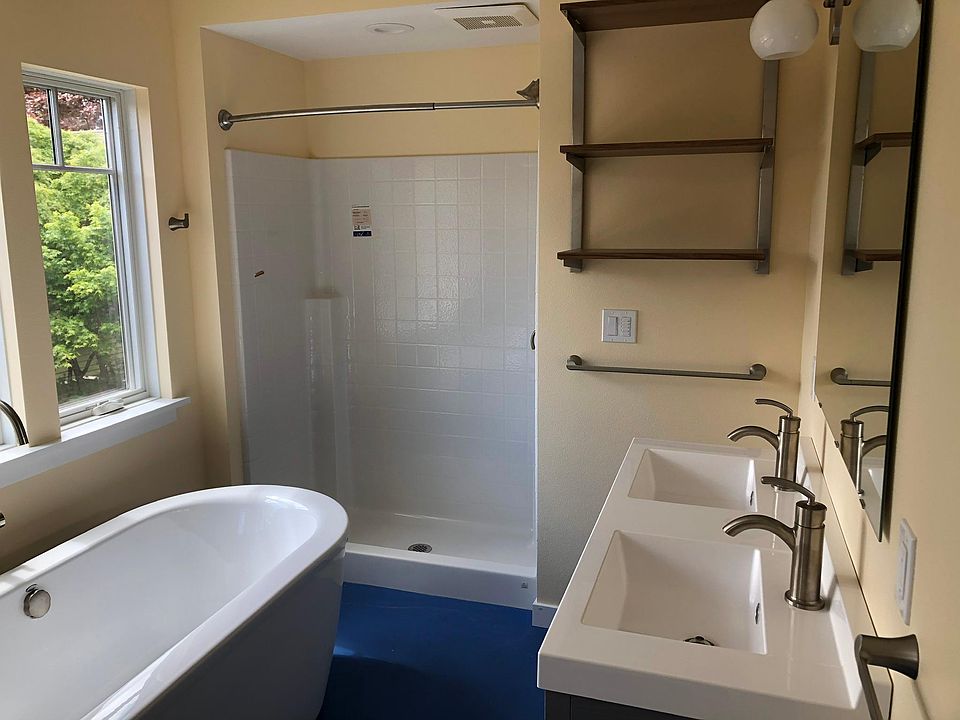Deluxe bathroom with deep soaking tub and shower