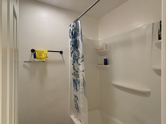 Tub shower, toilet in one room & a separate sink out side.