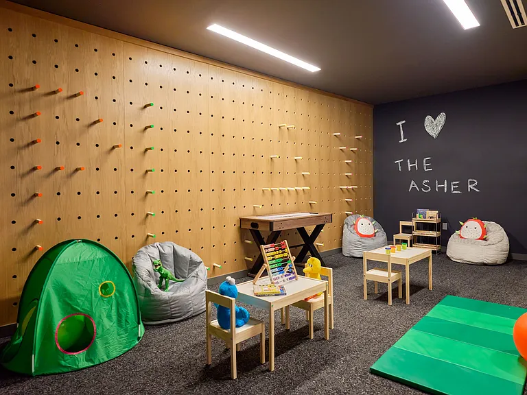 Playroom outfitted with a variety of toys and activities