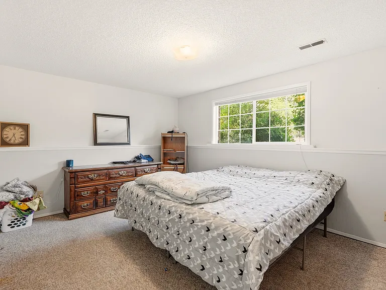 first lower level bedroom has large window providing plenty of natural light