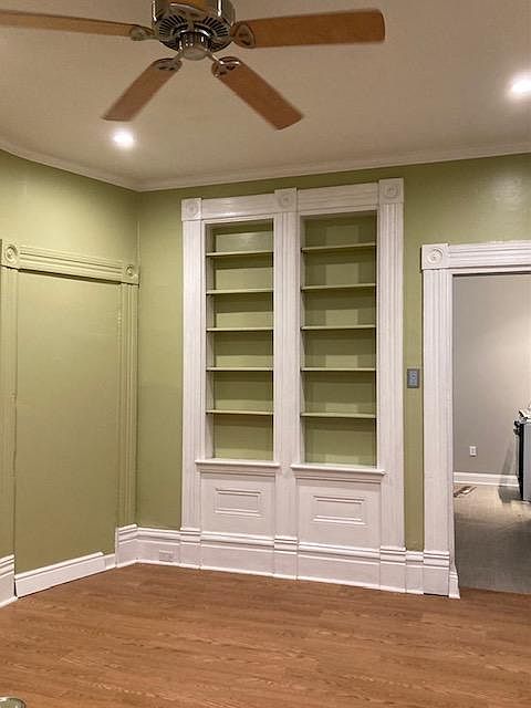 Large living room, 16'x 12', newly painted, recessed lights , fireplace, ceiling fan, built in bookcase.