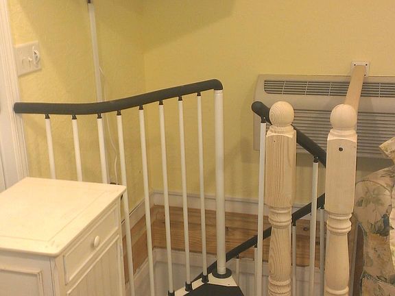 spiral staircase to lower bedroom