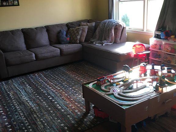 Large family room with durable engineered flooring.