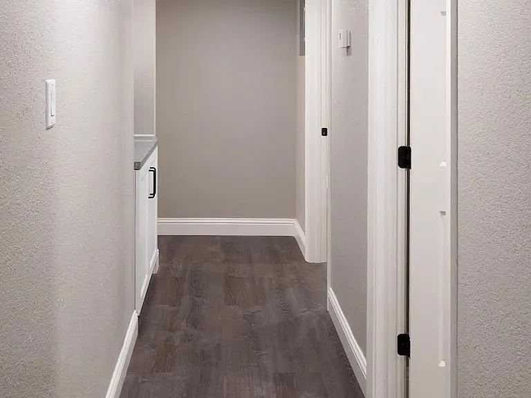Both bedrooms are on the the right; hall bath is at the end to the left