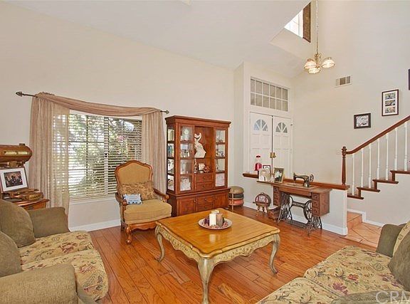Wood flooring extending into the dining room.