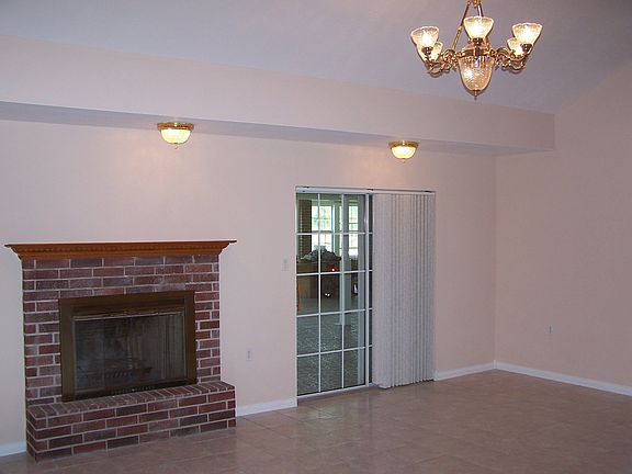 Livingroom. Sliding door leading to 1200 sq.ft. room in the back of the home