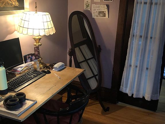 Little room off of living room that steps into the sun room at front of house