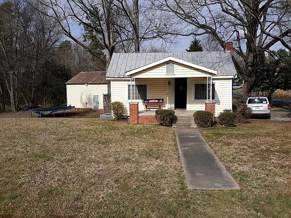 Spacious lot with Barn and creek yet close to all major Durham highways